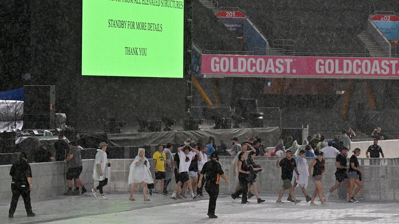 Pearl Jam fans are ushered out of the Gold Coast venue due to a storm