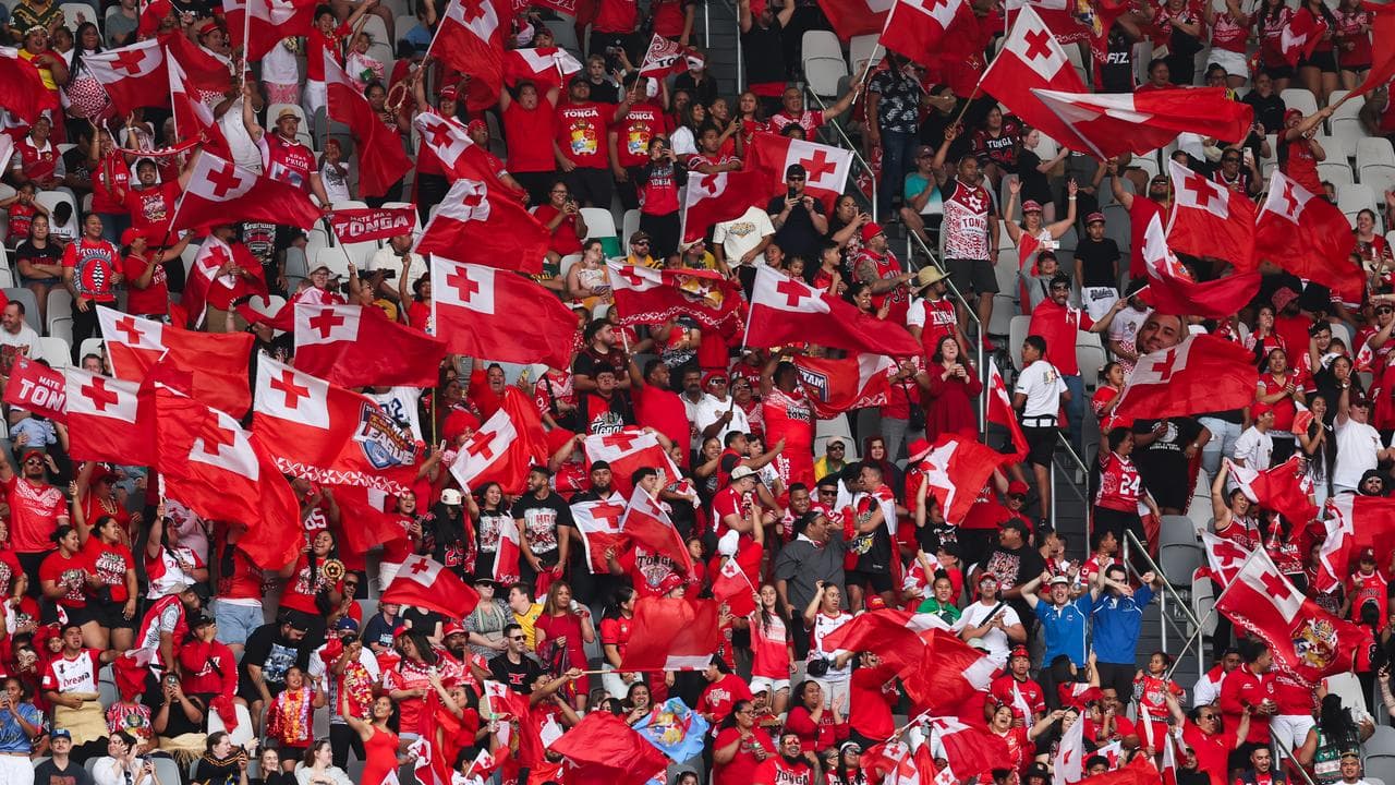 Celebrating Tonga fans.