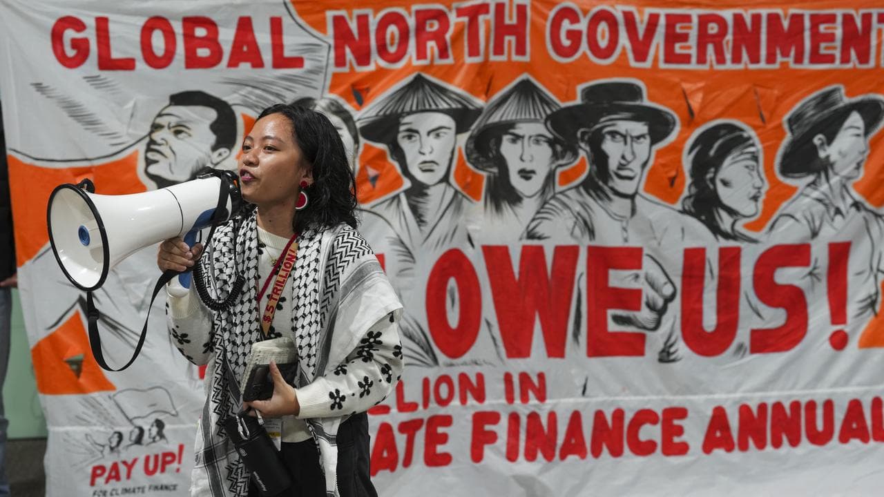 Activists protest for climate finance at COP29 in Baku