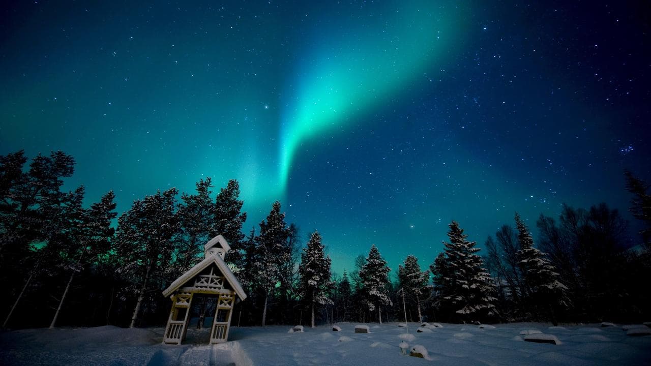 The aurora borealis appears in the sky in northern Norway.