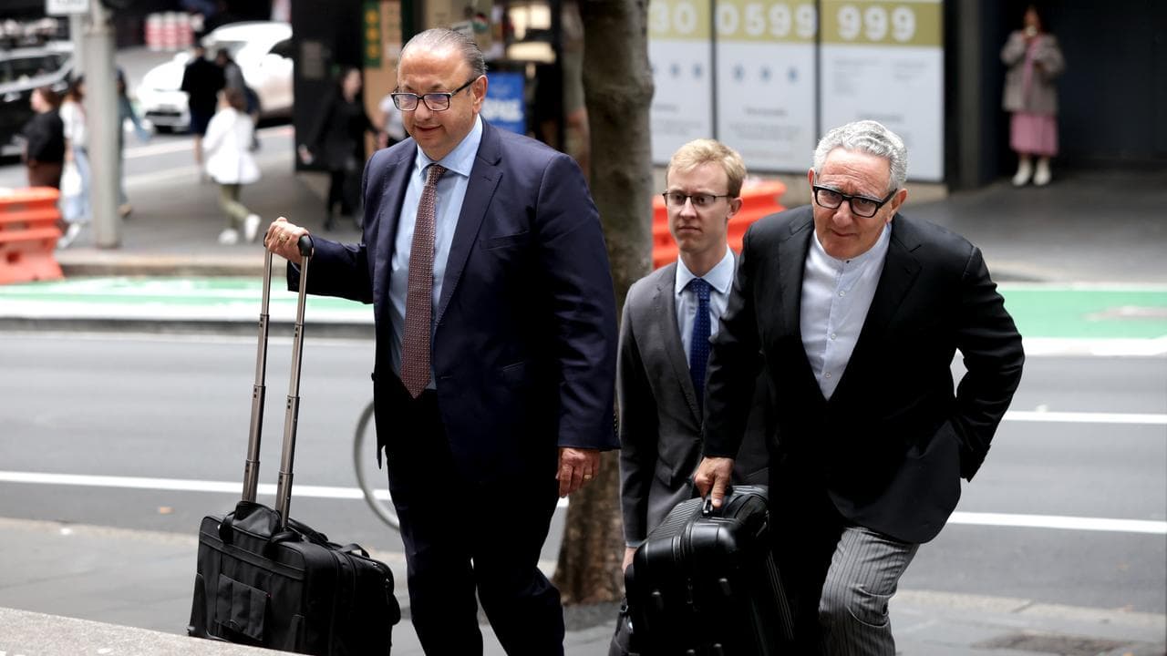 Adebb Sukkar's lawyers Elias Tabchouri and Greg Stanton with a clerk