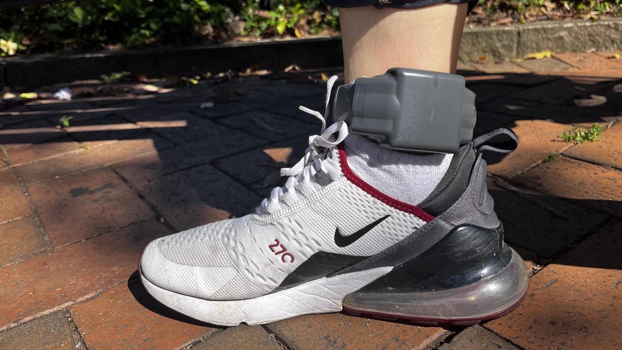 Afghan refugee wearing ankle bracelet