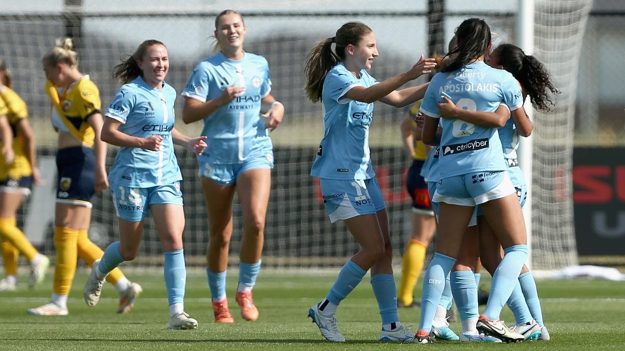 Melbourne City players celebrate a goal  against the Mariners.