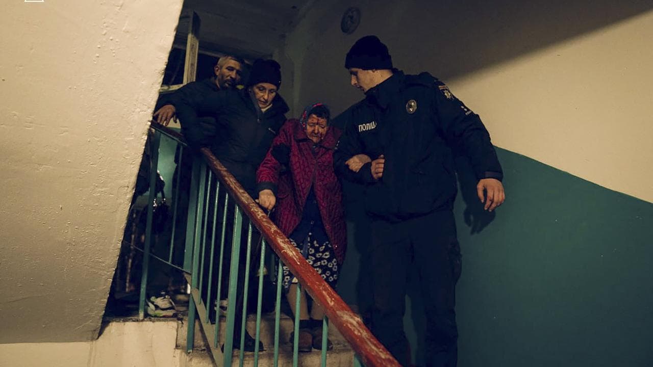 Rescue workers help residents in Sumy 