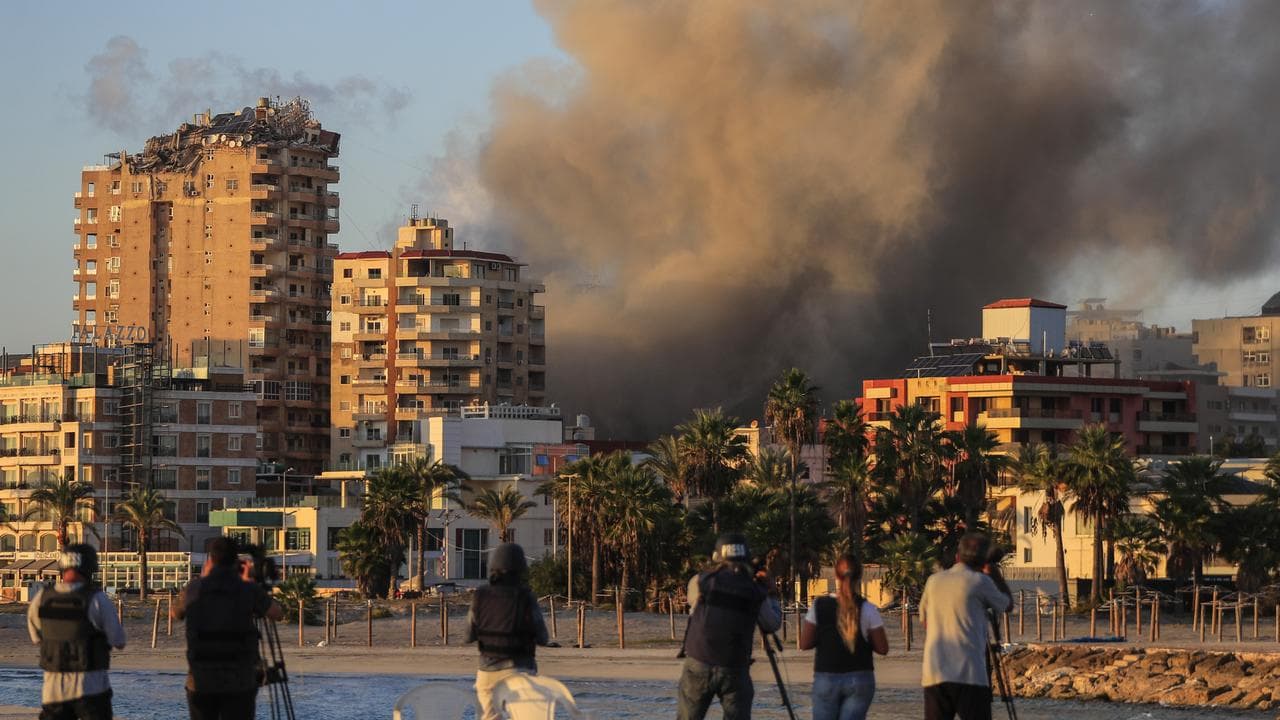 Smoke rises from a building hit in Israeli airstrikes in Tyre, Lebanon