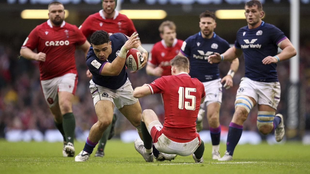 Former Rebels centre Sione Tuipulotou (second left).