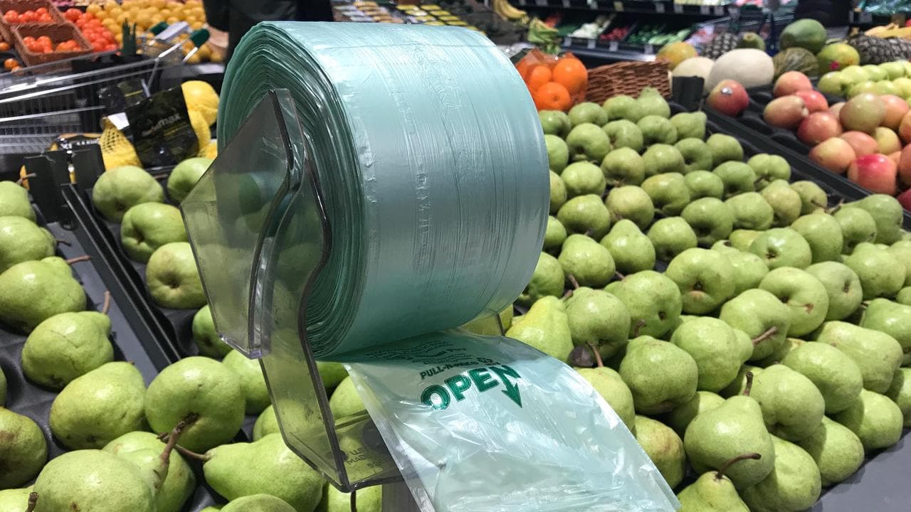 A plastic bag dispenser at a Woolworths supermarket