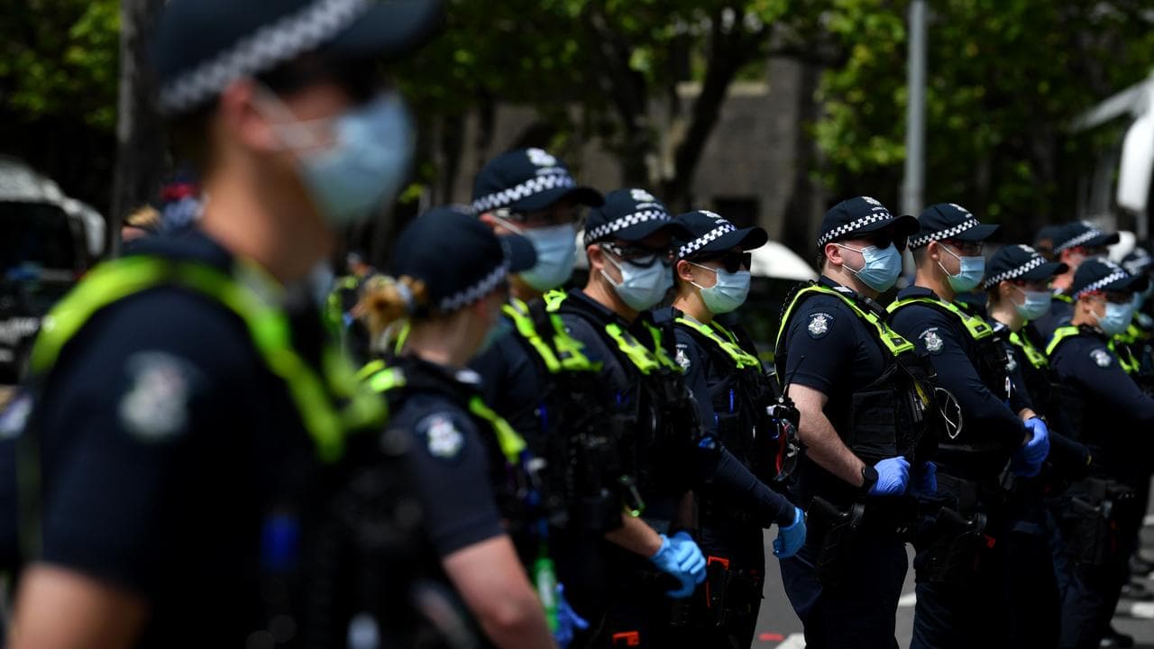 Police at an anti-Covid protest