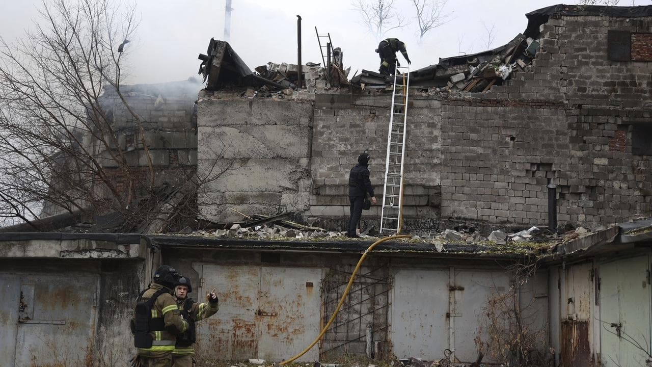 Emergency crews at a building damaged by a Russian strike in Dnipro