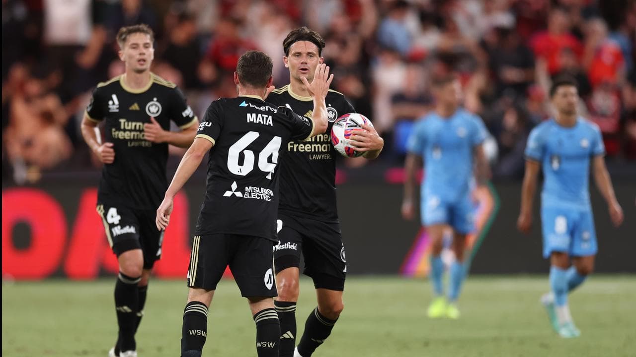 Marcus Antonsson of the Wanderers and Juan Mata
