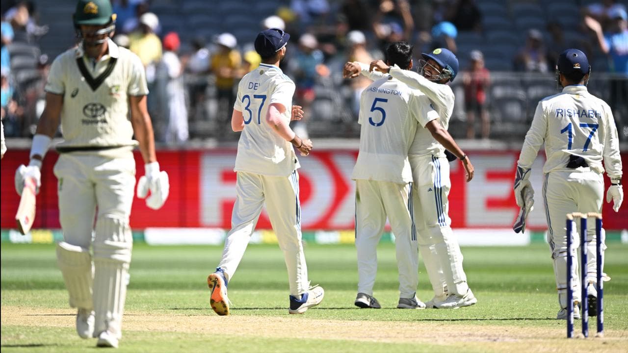 India players celebrate a wicket.