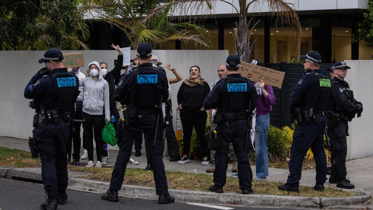 Pro-Palestine activists are separated from pro-Israel protesters