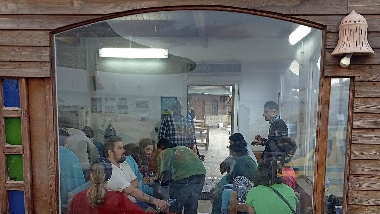 Survivors rest at a coffee shop in Marsa Alam