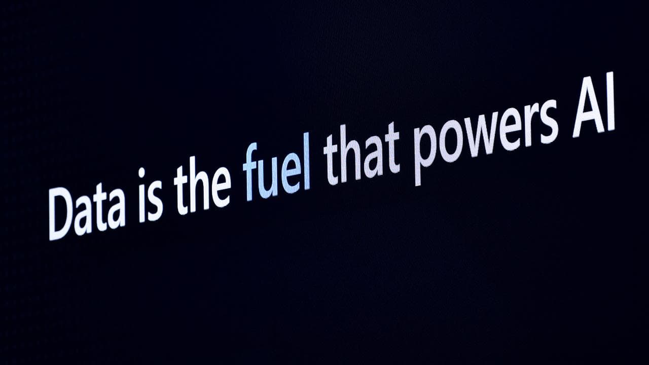 AI and Microsoft posters are seen at the Microsoft AI Tour