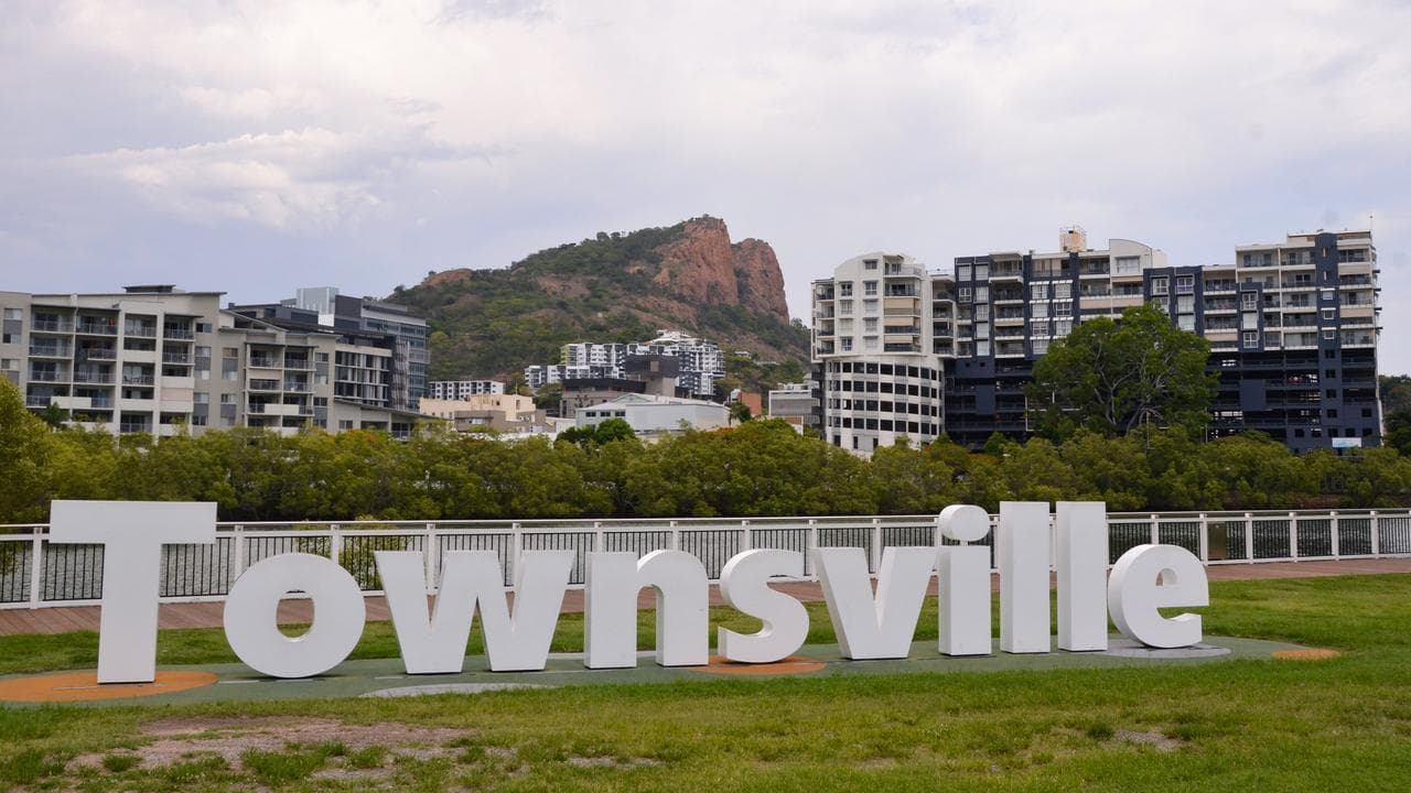 View of the Townsville sign with Castle Hill in the background