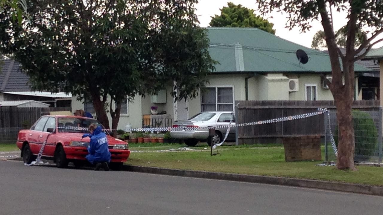 Forensic officers at the crime scene (file image)