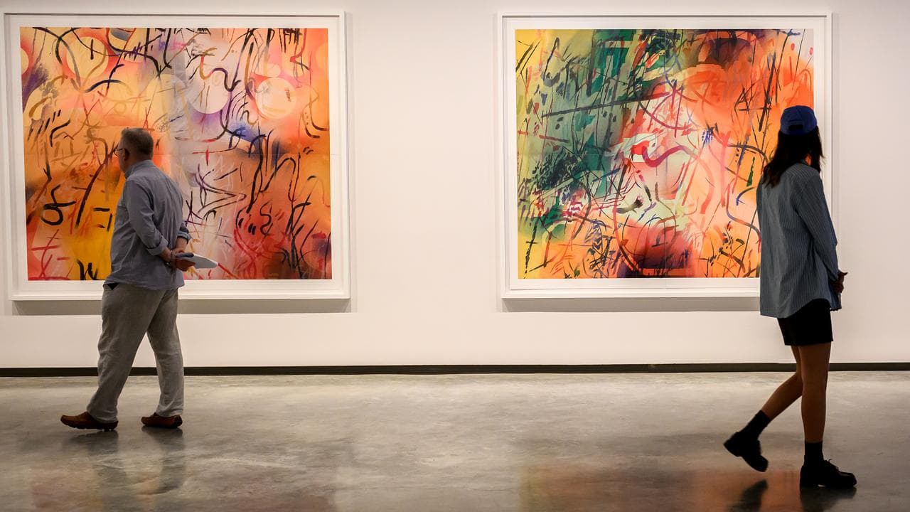 People view some of the artworks