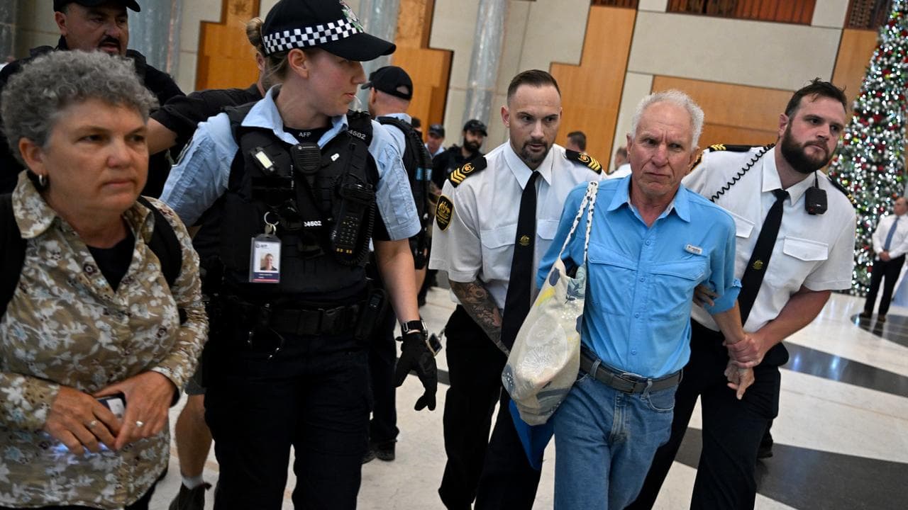 Climate protesters being removed from Parliament House