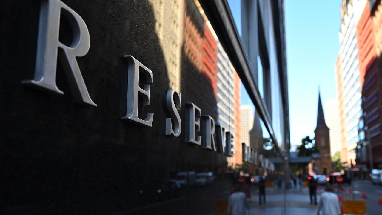 People walk past the Reserve Bank of Australia in Sydney