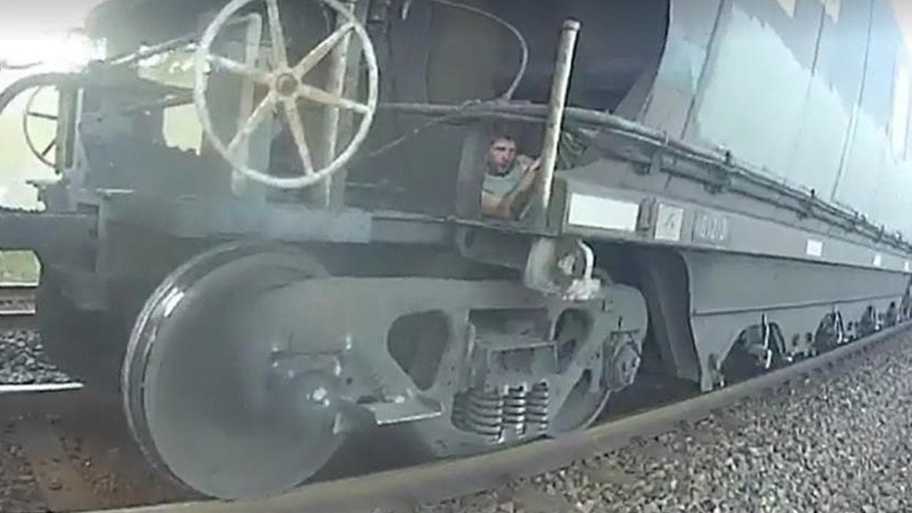 Matthew Breckenridge hiding on a train