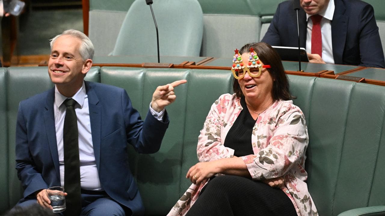 Minister Madeleine King in Xmas-themed glasses in parliament.