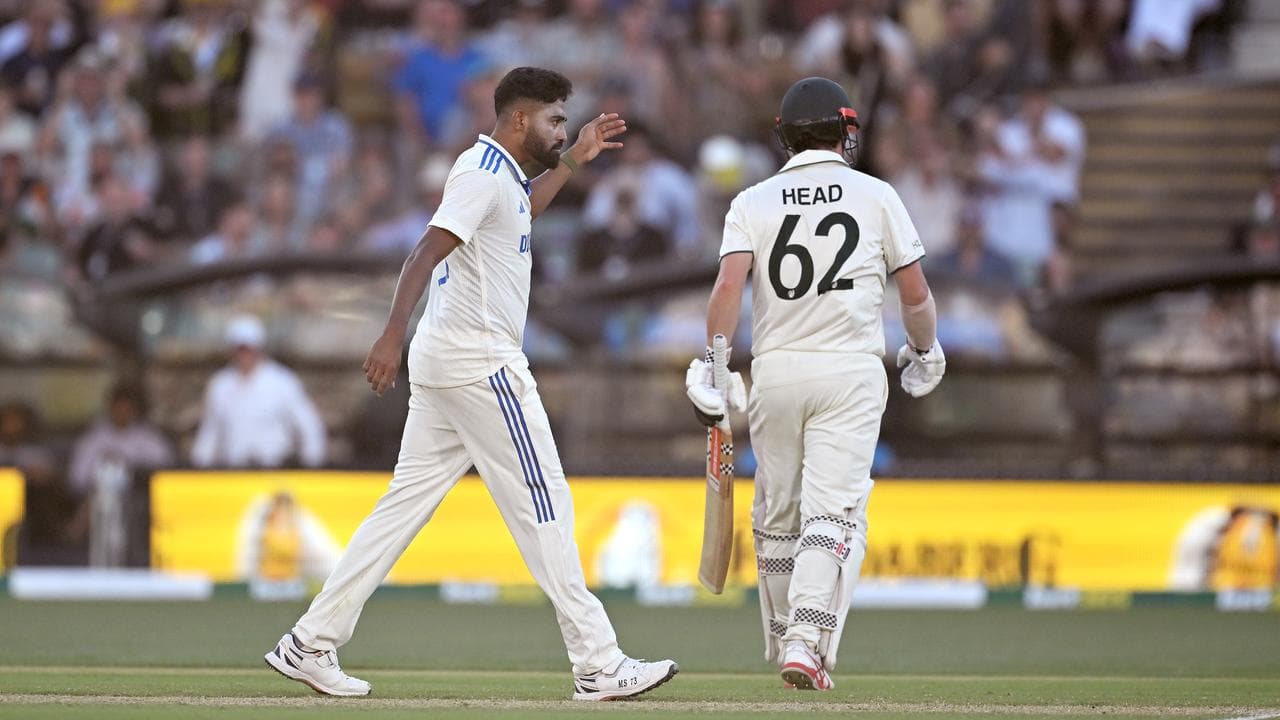 Mohammed Siraj (left) tells Travis Head where to go.