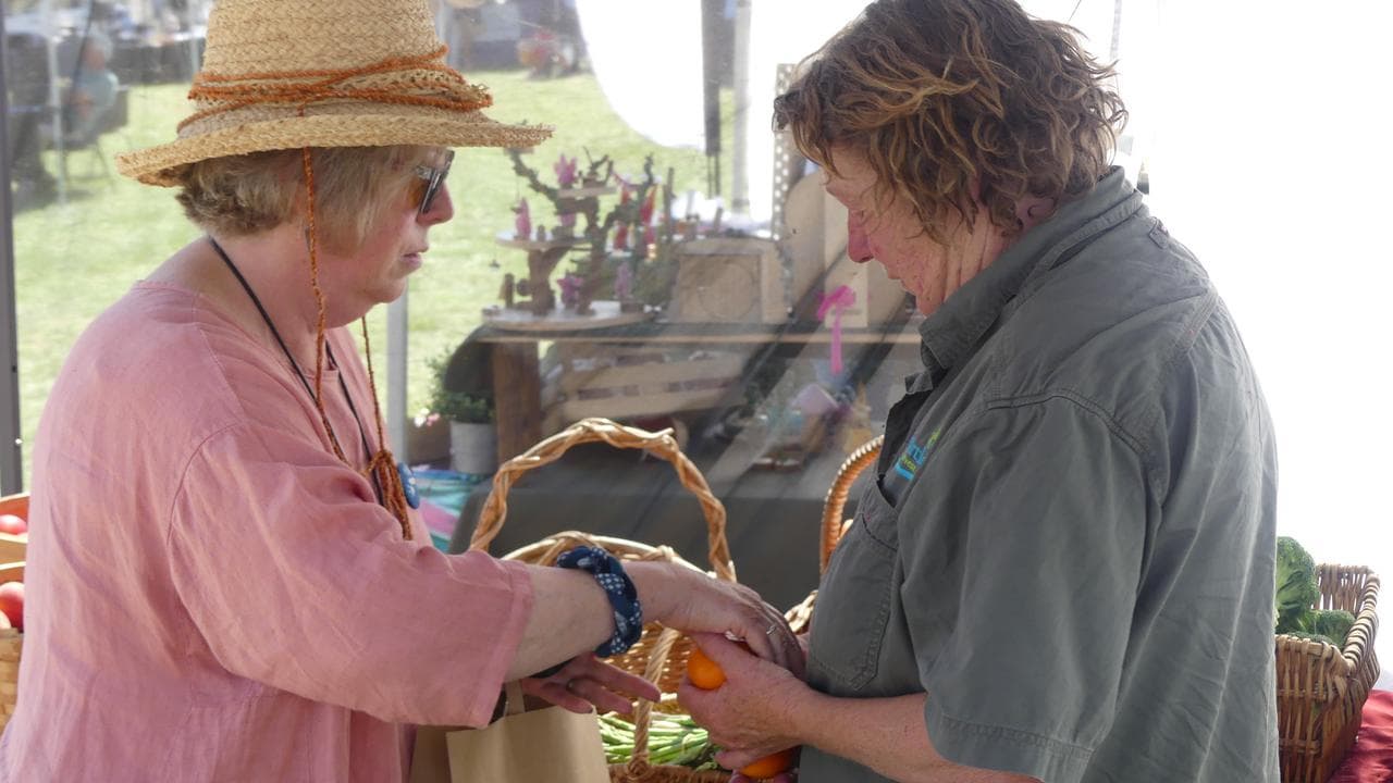 Denise Mole serves customer