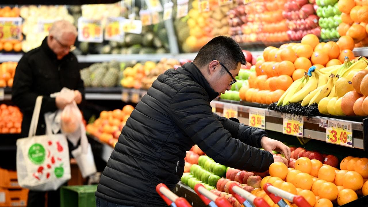 Shoppers at a fruit market