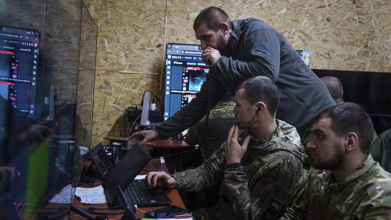 A Ukrainian officer speaks on radio to his soldiers 