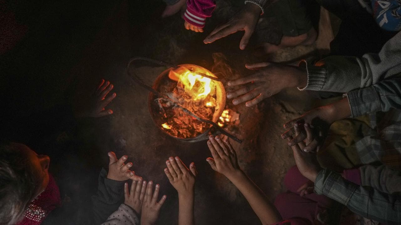 A displaced Palestinian family at a camp in Khan