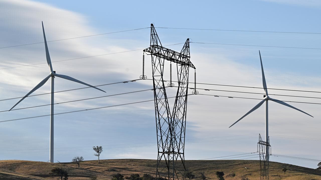 Power-generating windmill turbines and electricity pylons
