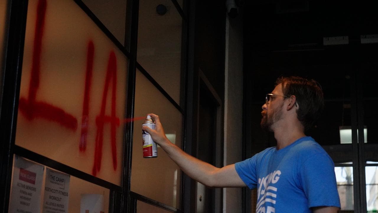 Zack Schofield spray paints 'Liar' on Tanya Plibersek's  office 