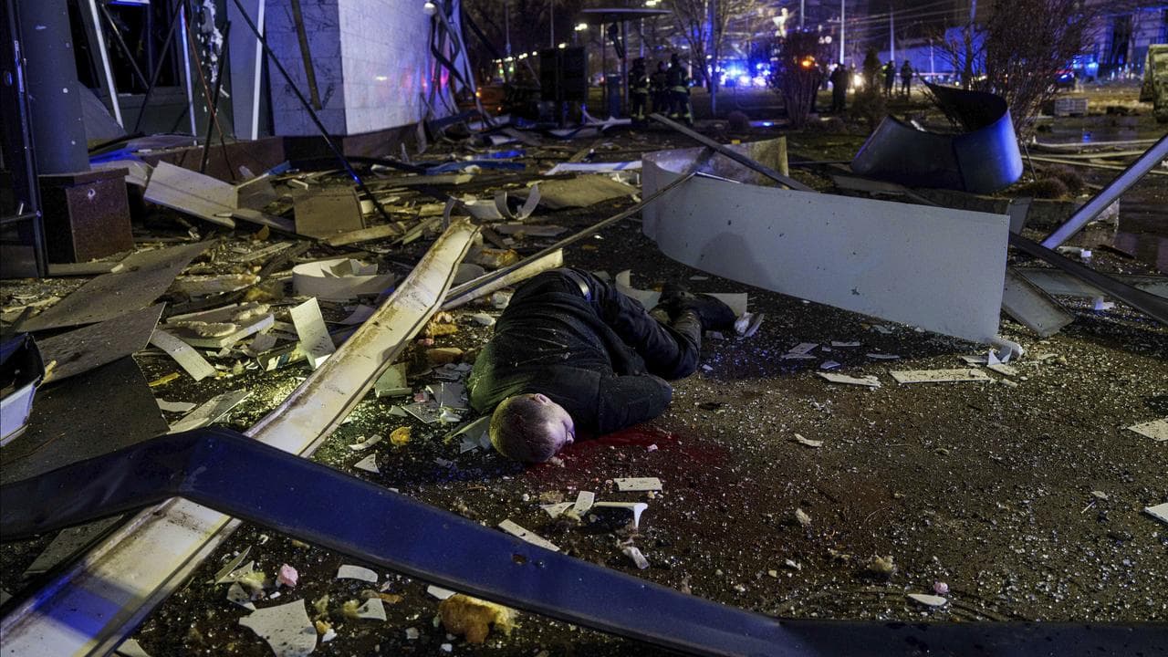 The body of man on a street after a Russian missile strike on Kyiv