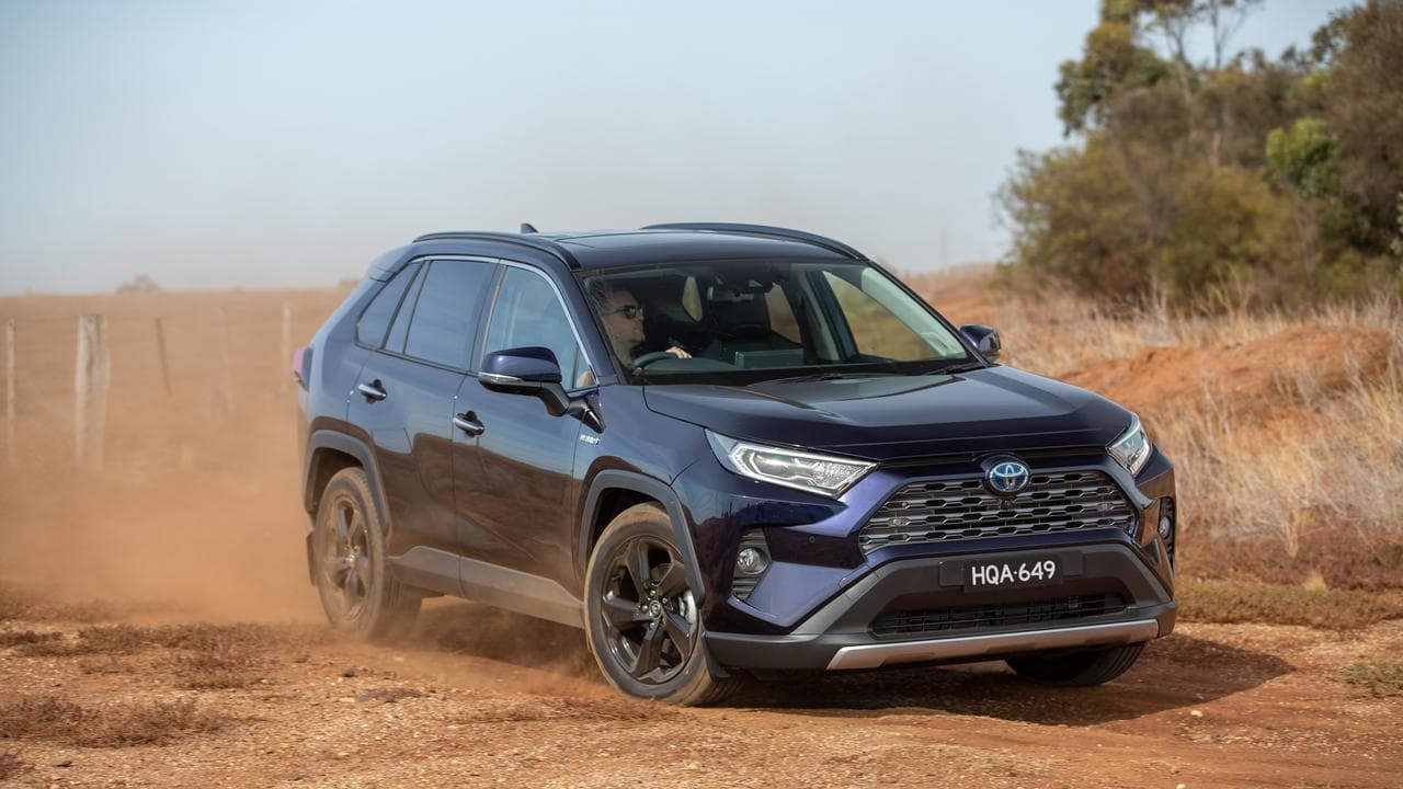 A Toyota RAV4 driving on dirt.