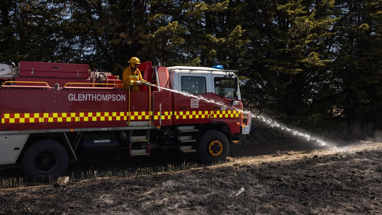 Firefighters conduct back burning on the outskirts of Dunkeld.