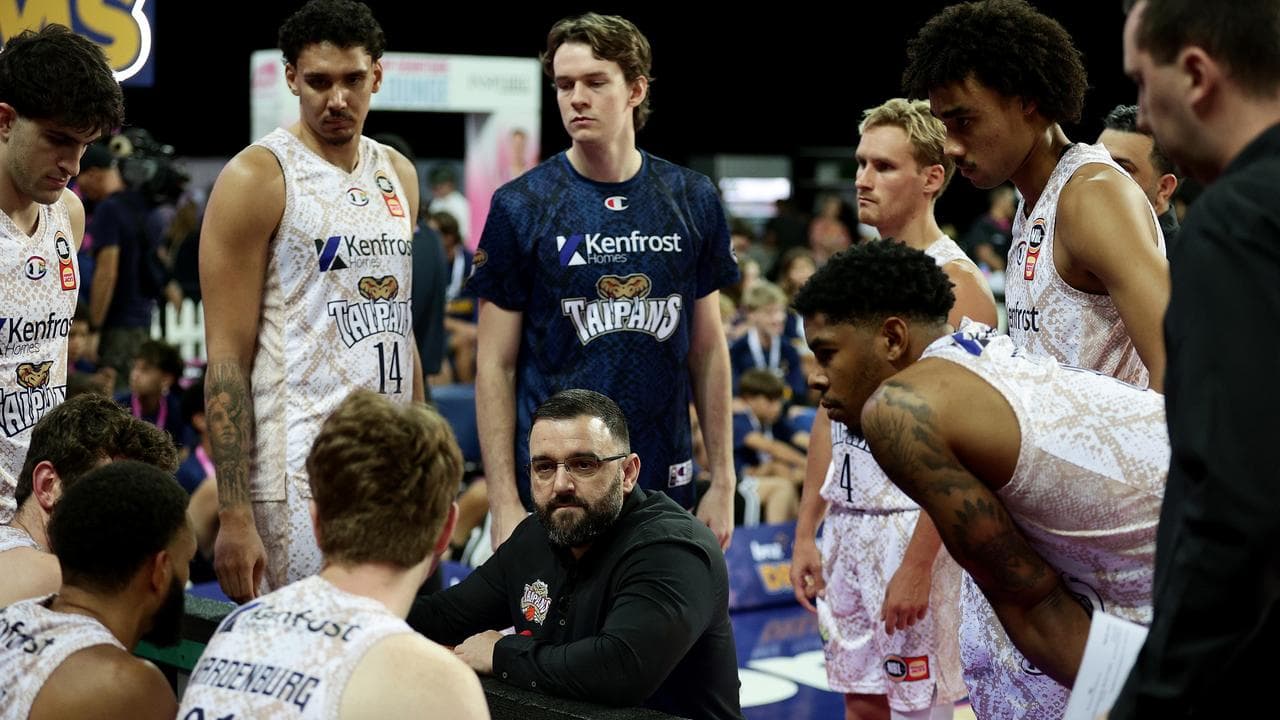 Taipans coach Adam Forde revs up his players.