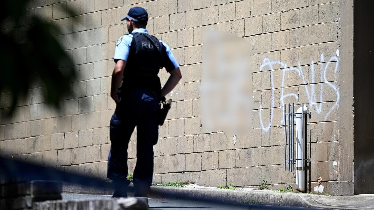 A wall is spray-painted with anti-Jewish slogans