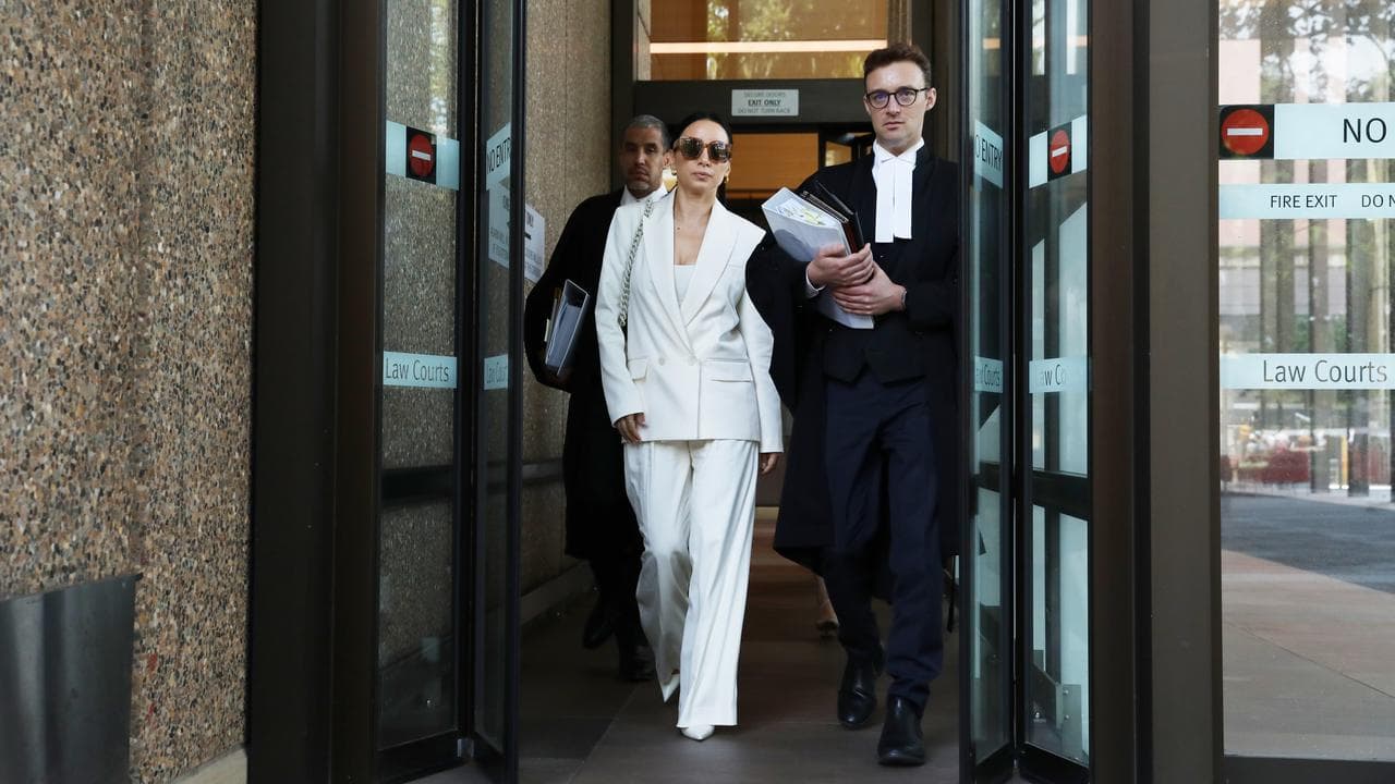 Former ABC journalist Antoinette Lattouf (centre)