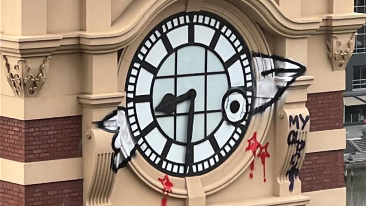 Graffiti on the Flinders Street Station clock tower (file)