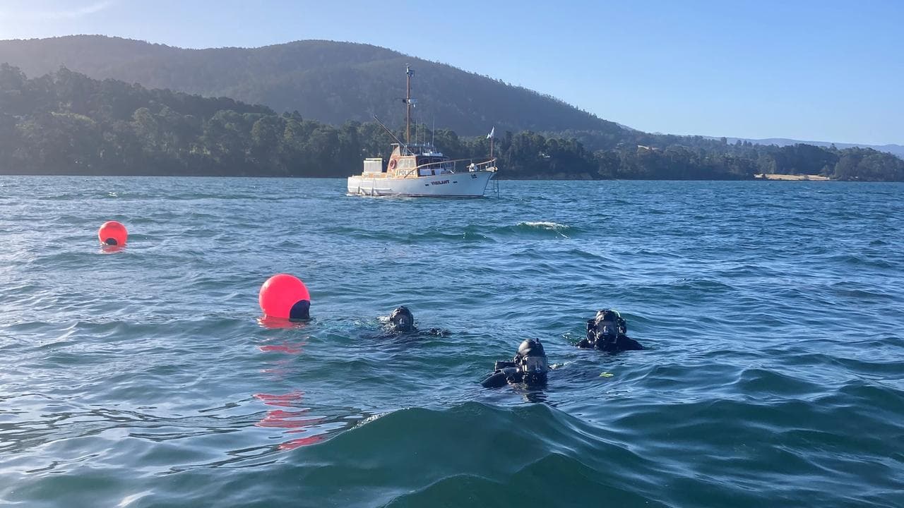 Divers at the site of the historic boat's sinking