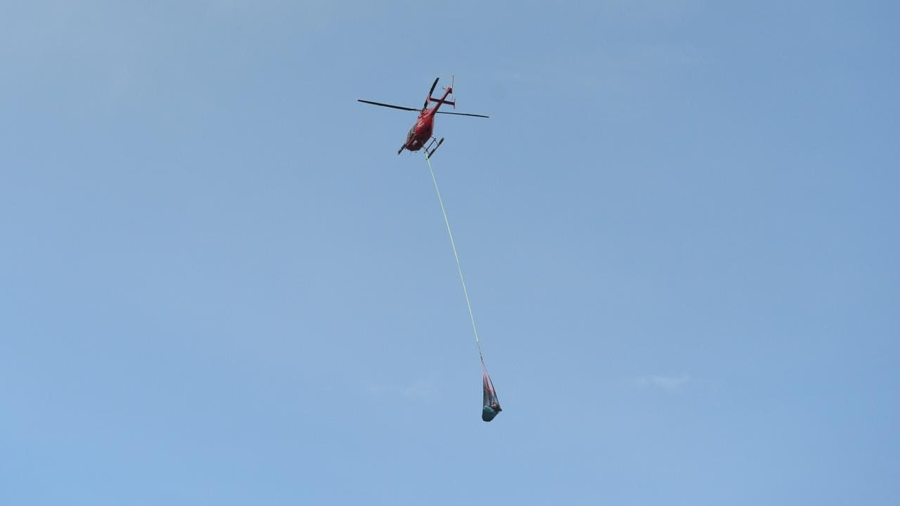 A helicopter transports supplies north of Townsville