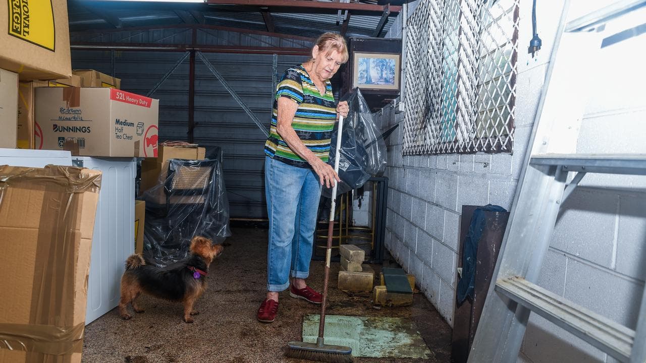 Judi Hinspeter cleaning at her Mundingburra home after severe rainfall