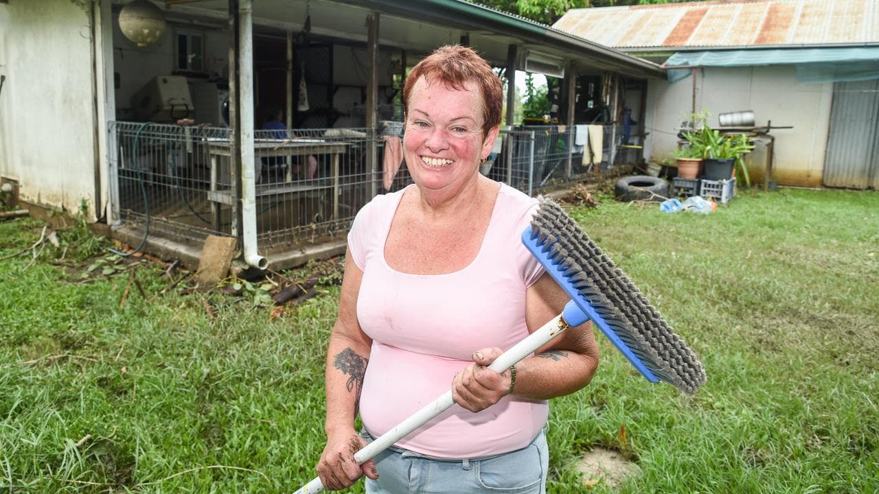 Woman cleaning up after floods