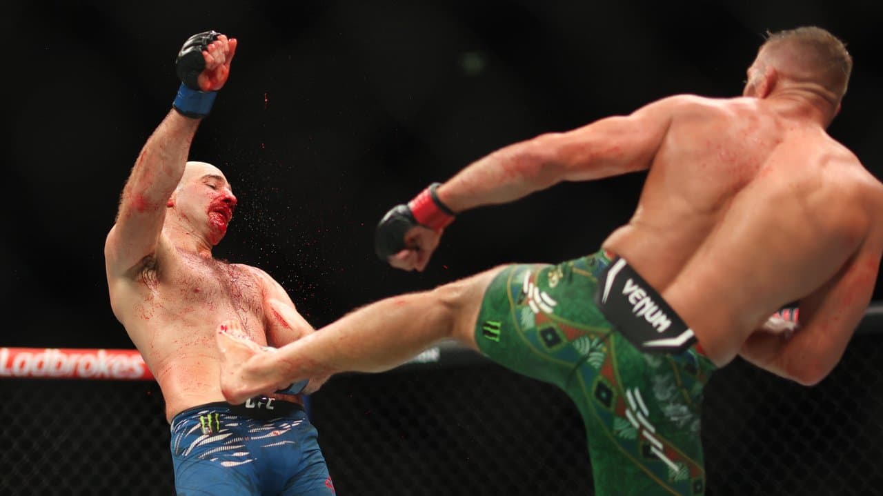 A bloodied Sean Strickland (left).