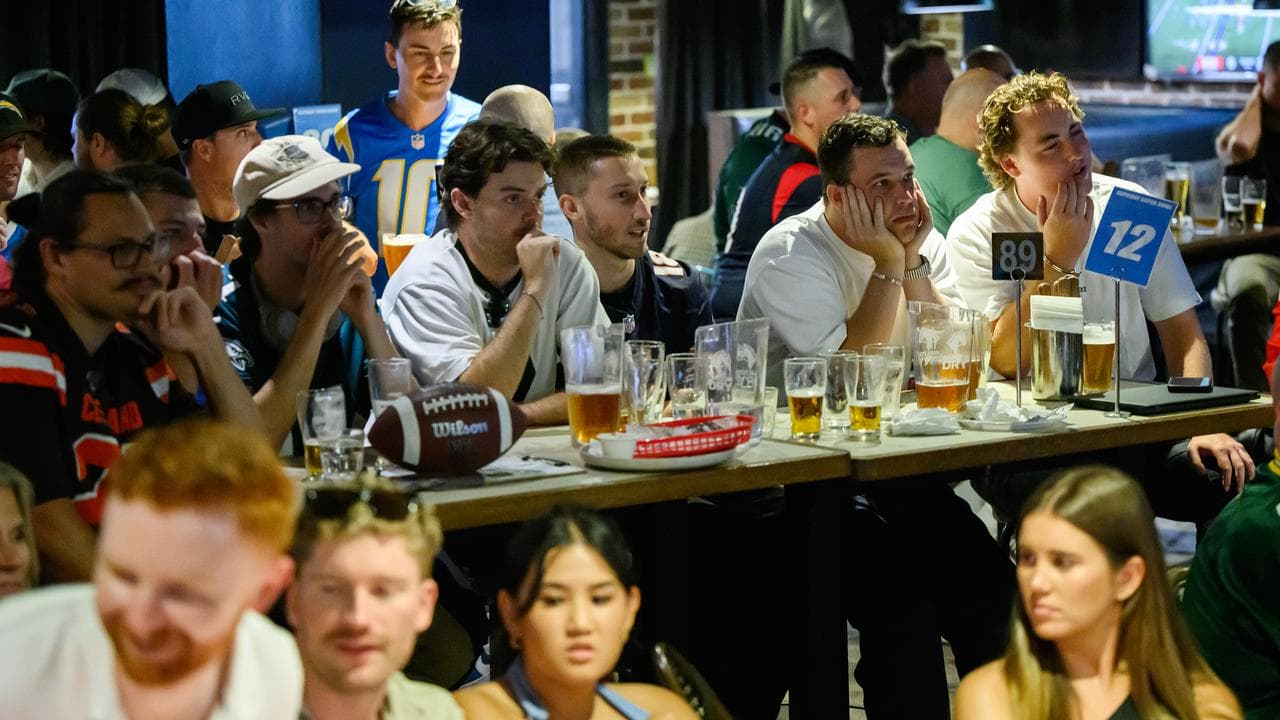 Fans watch the NFL Super Bowl LIX