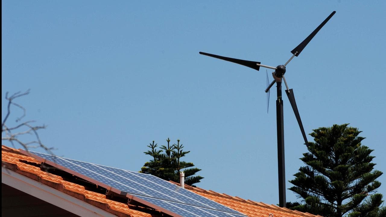 Solar panel & wind turbine on roof of home, North Bondi