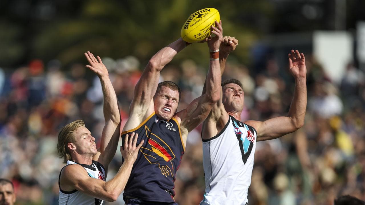 Reilly O'Brien between Miles Bergman and Jordon Sweet.