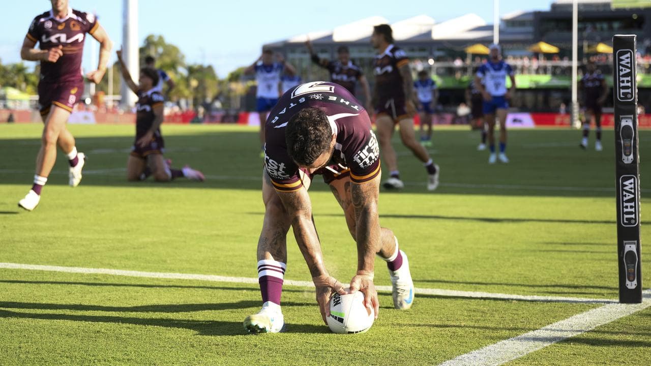 Brisbane's Adam Reynolds scores a try.