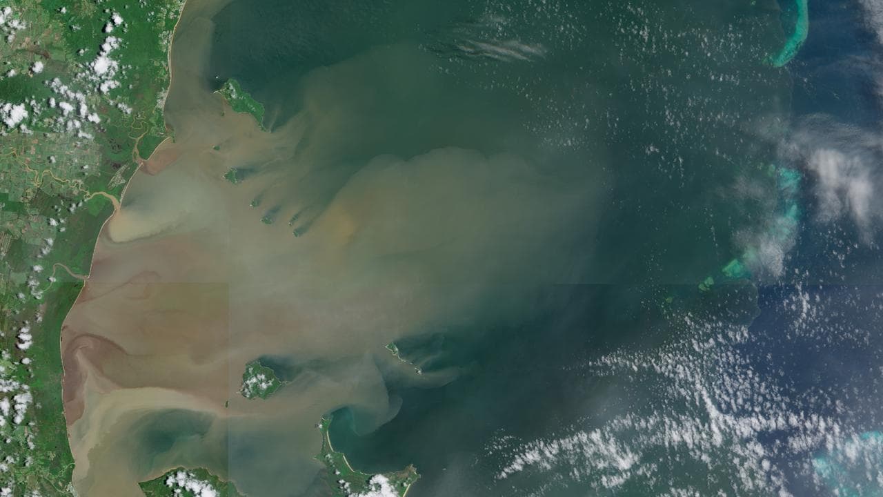 Floodwaters run into the Great Barrier Reef.
