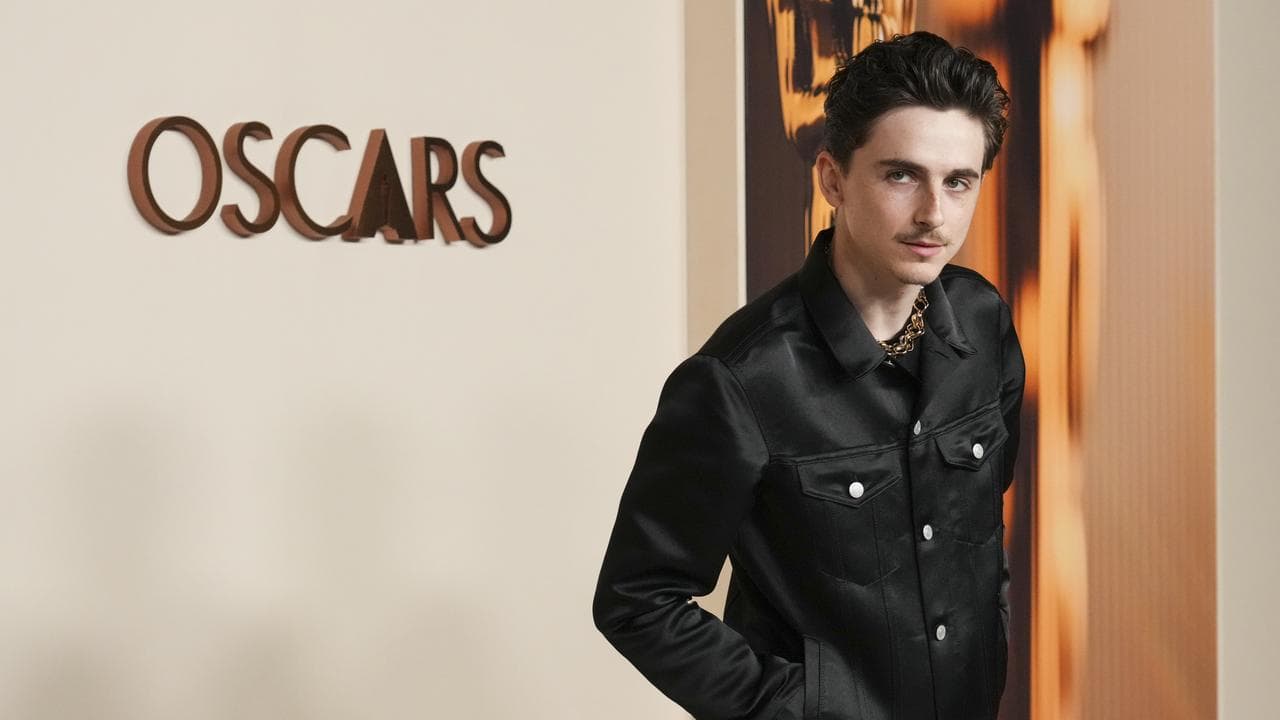 Timothee Chalamet arrives at the Oscars nominees dinner